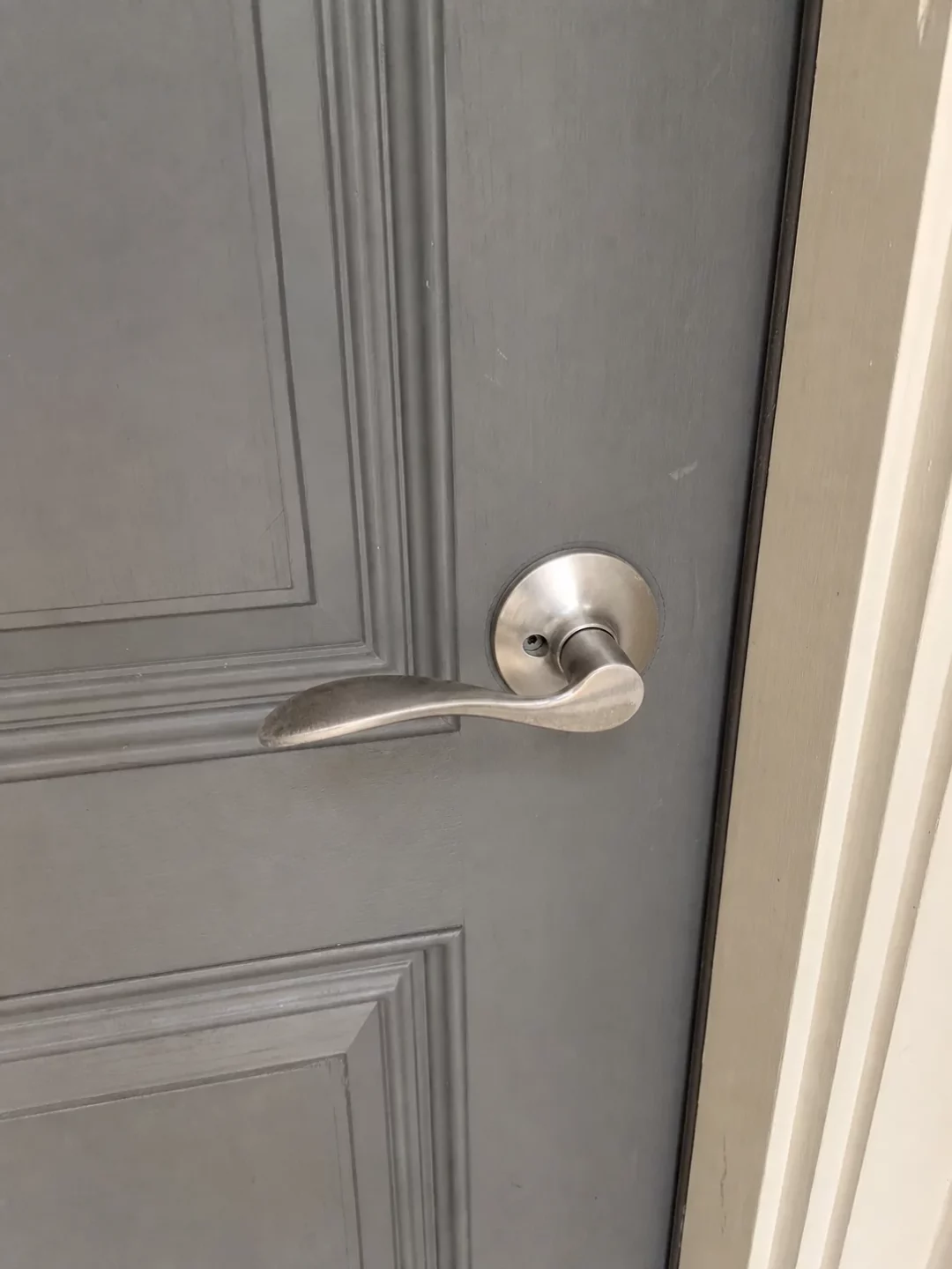 Intact residential front door handle