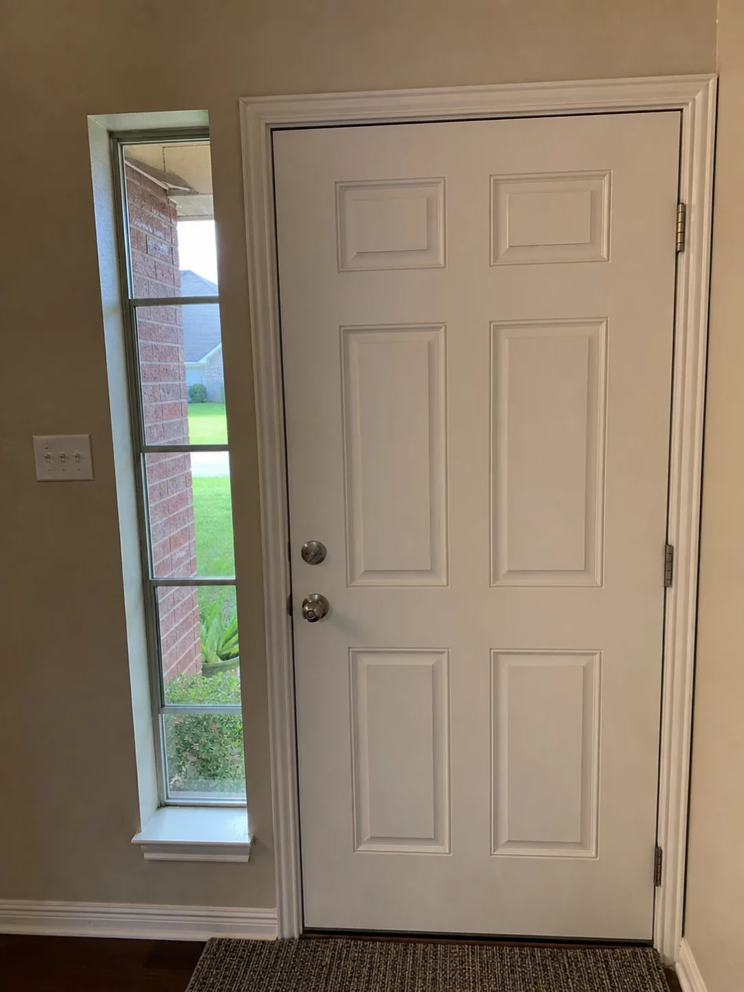 Front door viewed from inside a Houston home