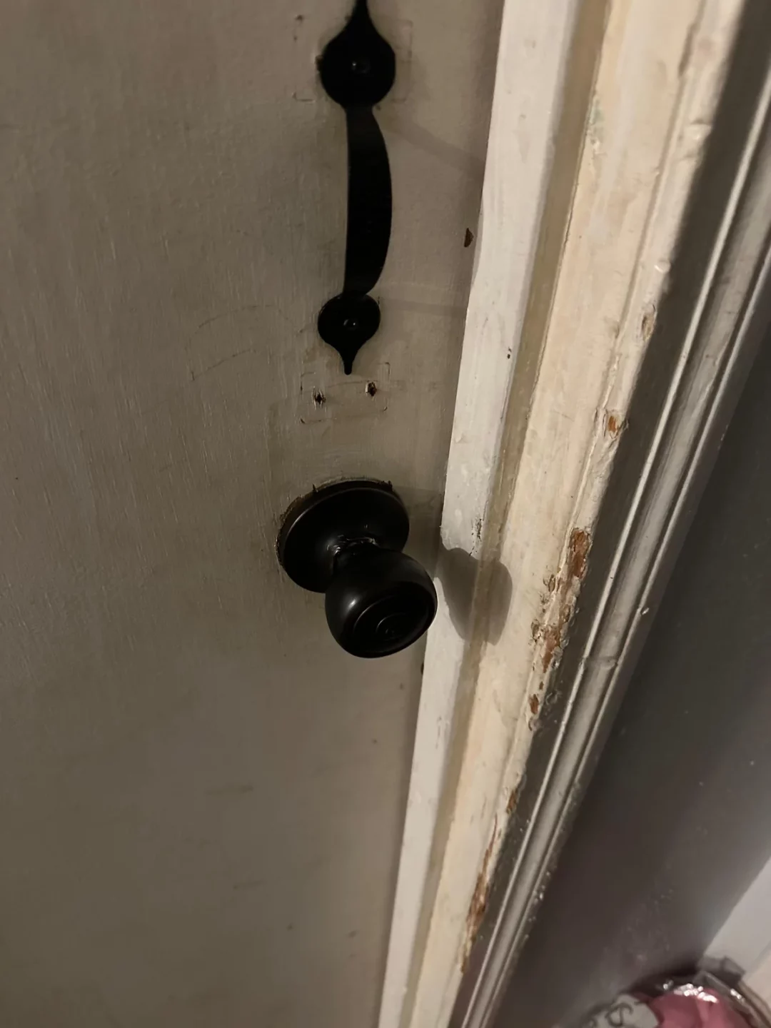 Front door hardware during a nighttime home access call in Houston