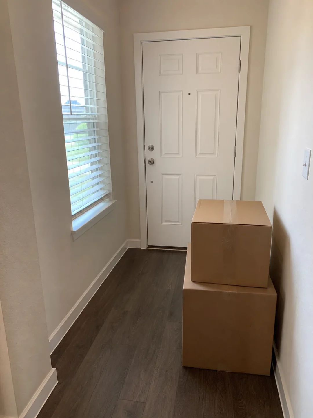 Moving boxes near the front door of a Houston home
